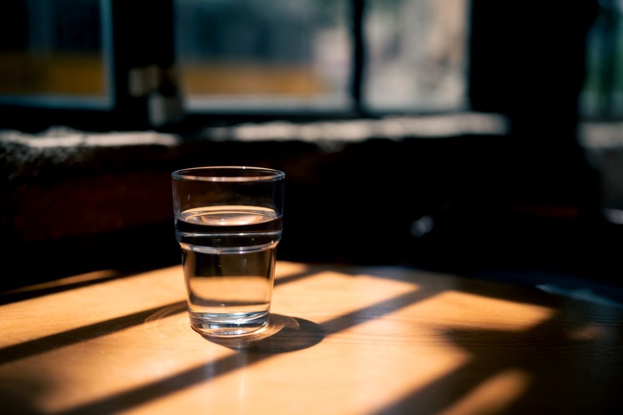 Warm morning light on an empty kitchen table representing the daily biological rhythm that inflammaging disrupts in adults over 55 managing poor sleep and joint pain.